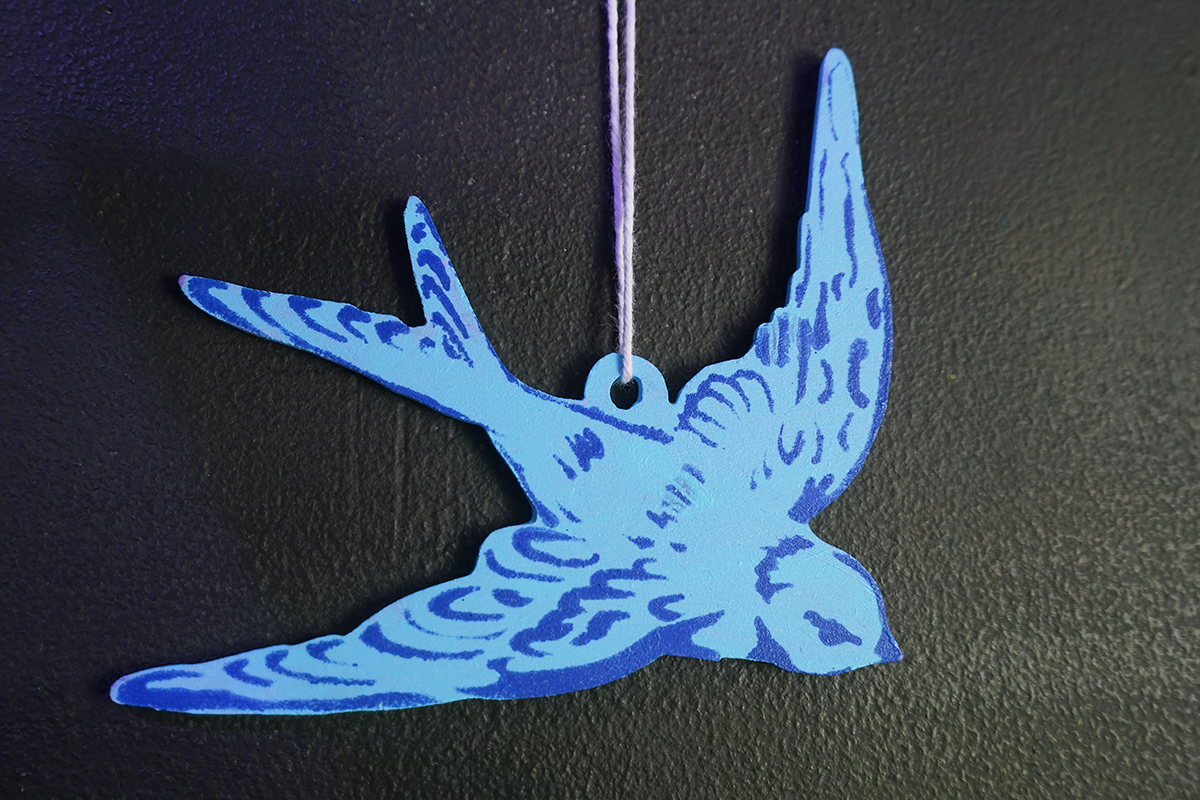swallow stencil painted ornament blue