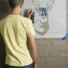 antlered deer stencil stenciling brick wall spray paint