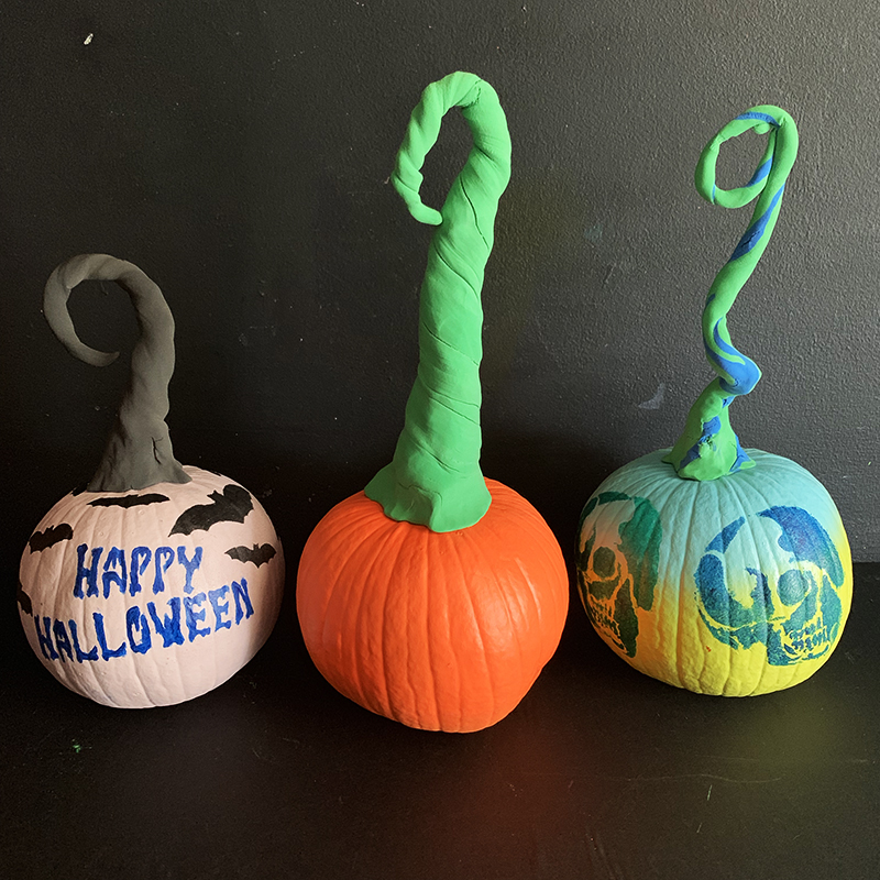 Stenciled pumpkins with clay stems