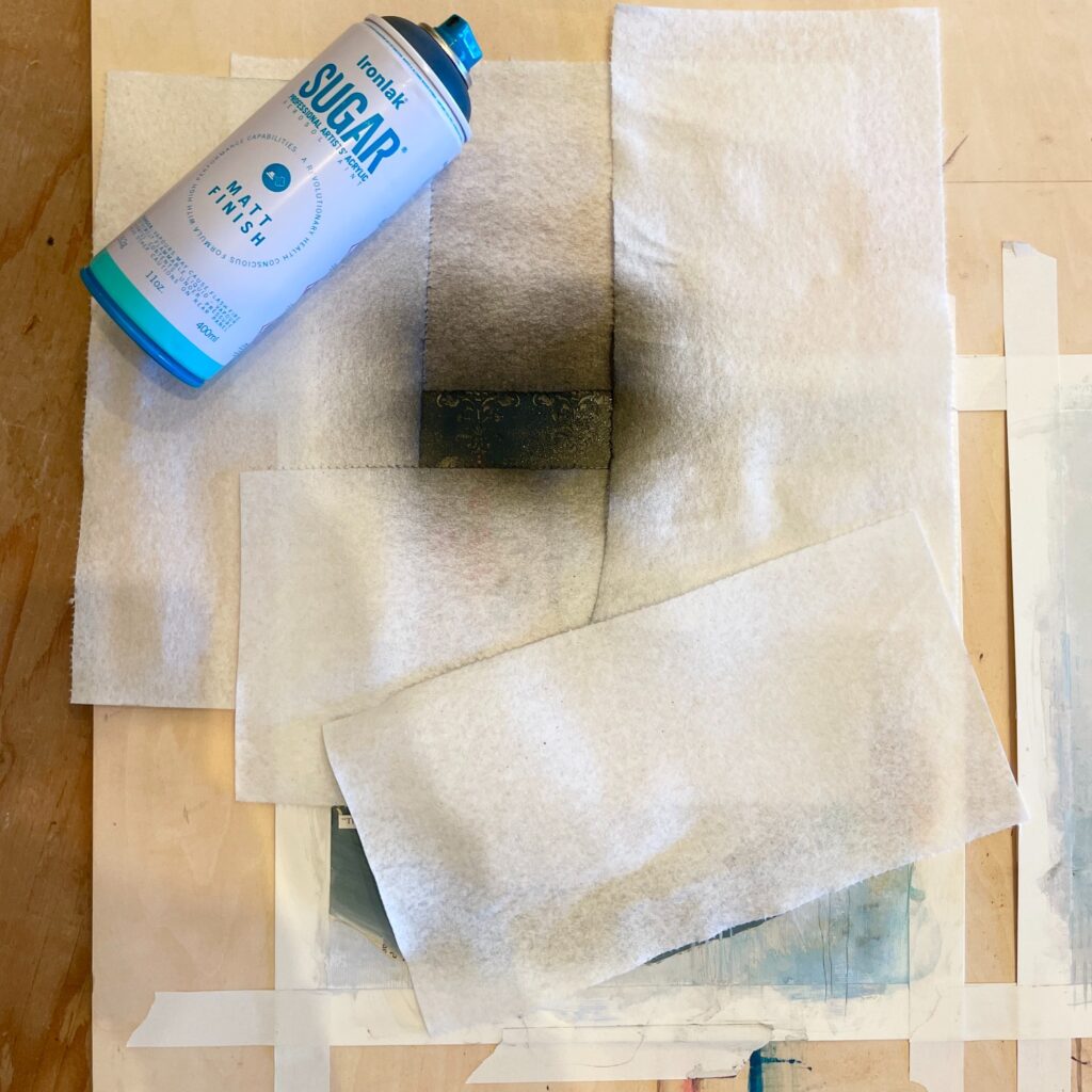 black spray paint and paper towel