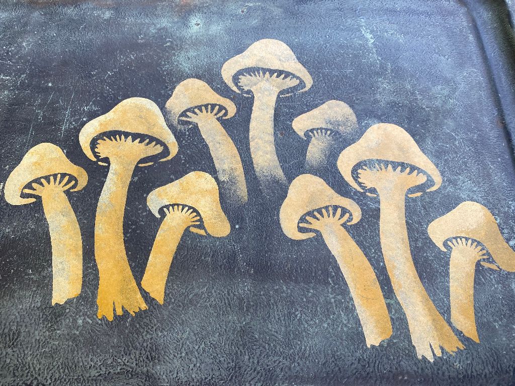 Mushrooms stenciled on a garden cart